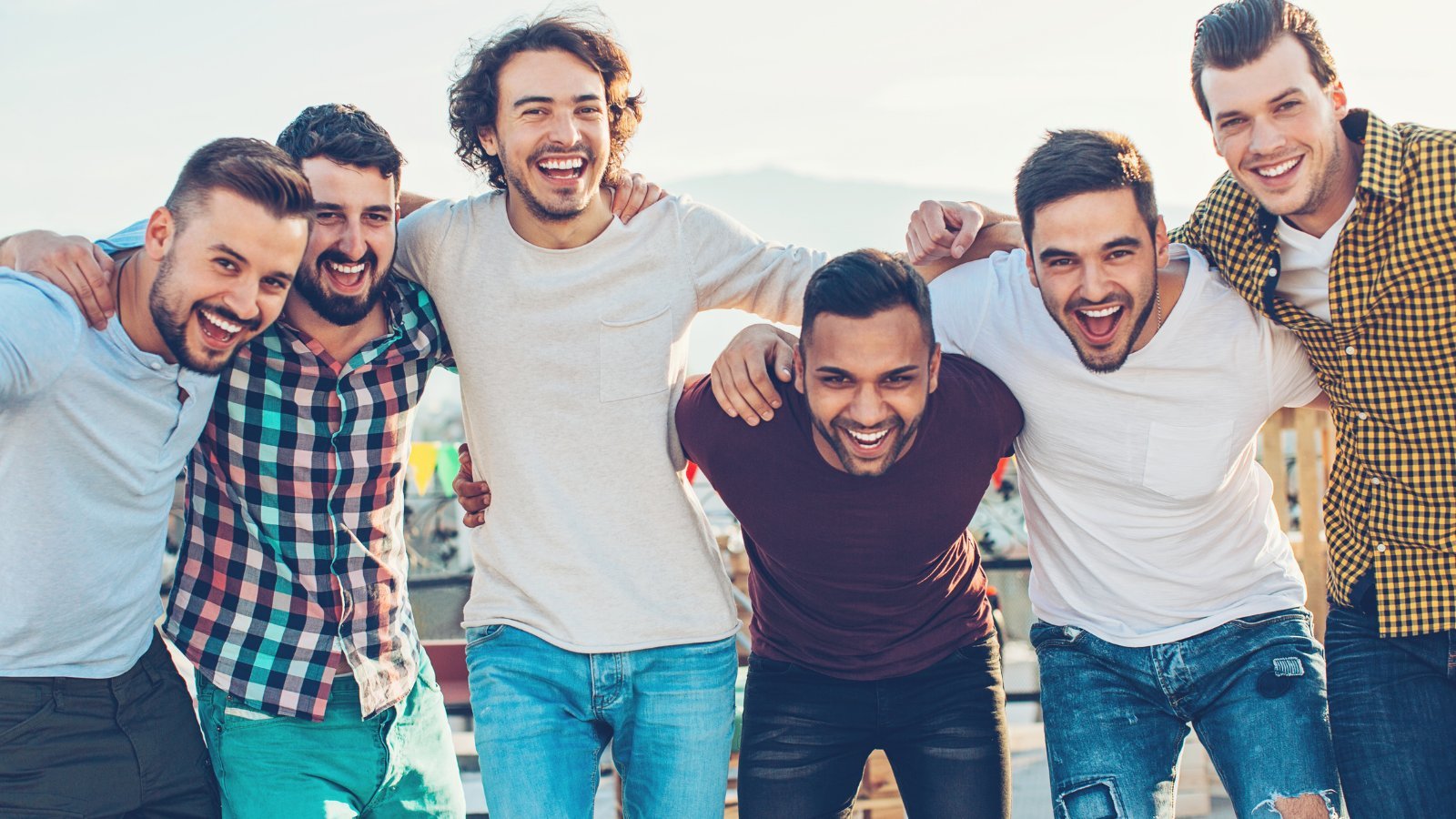 Group of men laughing outdoors — therapy for men Denver Colorado